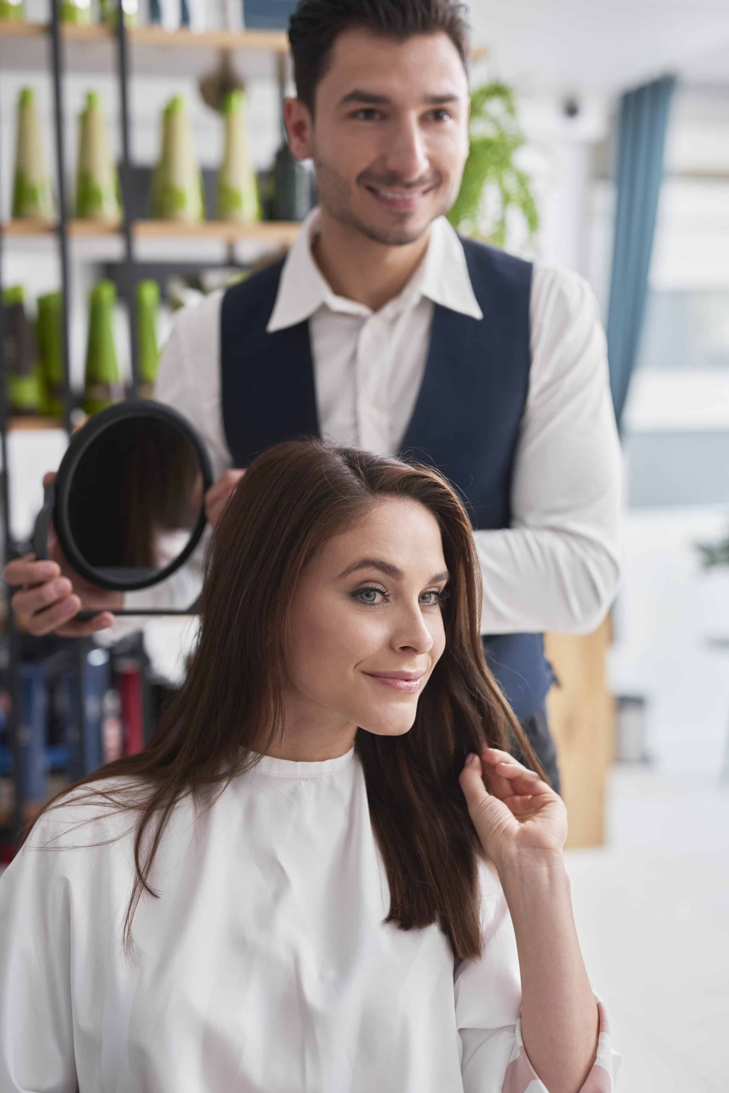 Hairdresser and female customer in hair salon